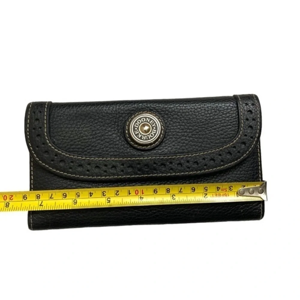 Dooney and Bourke rare perforated black pebbled leather 2 piece wallet set